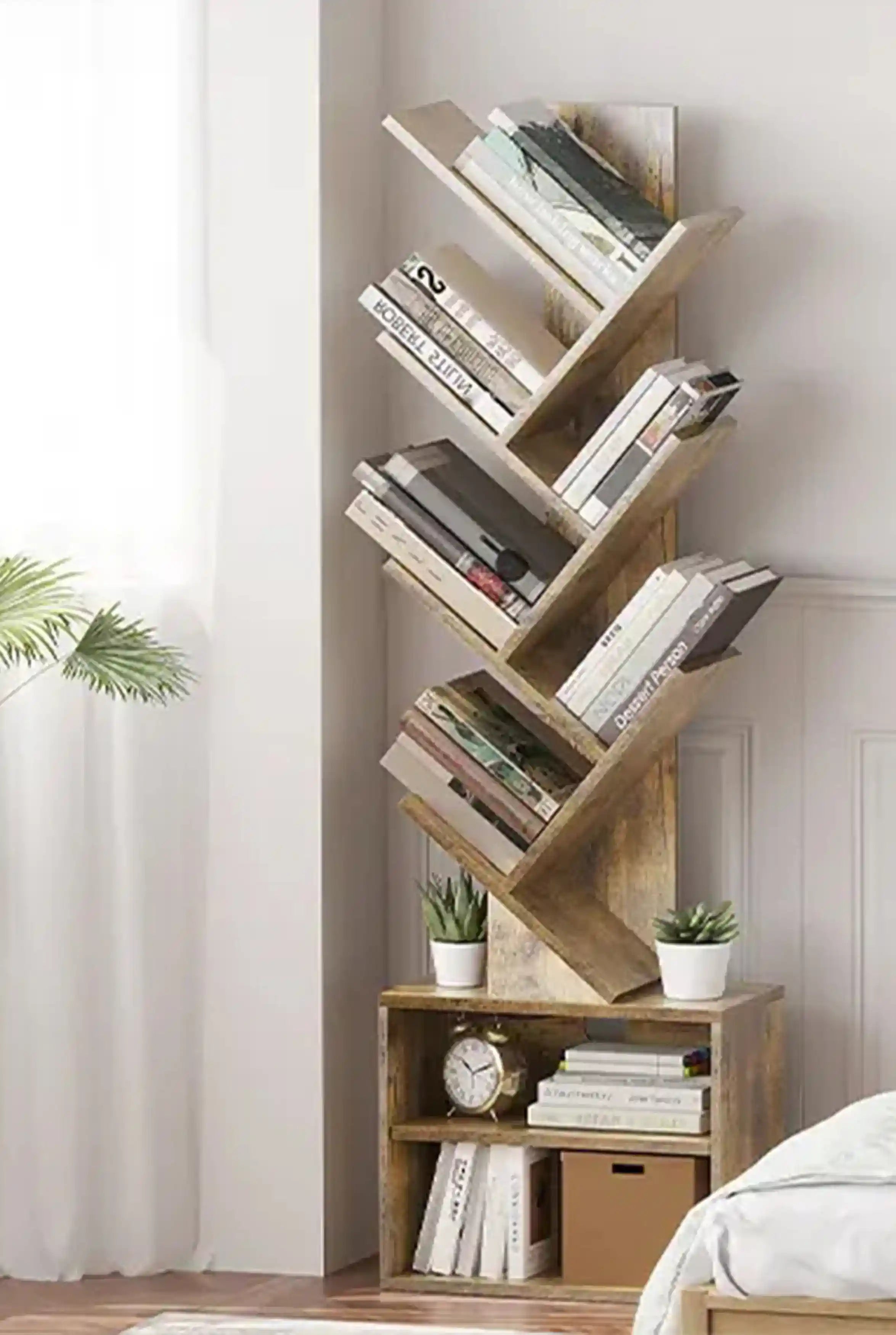 The Sunmory tree bookshelf with built-in storage cabinets, creating a cozy and organized reading nook next to a bed.