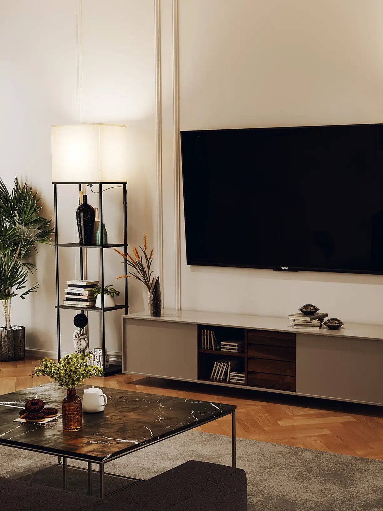 A Minimalist floor lamp with an elegant stand and a classic shaped fabric shade, adding warmth and timeless style to a cozy study or reading nook.