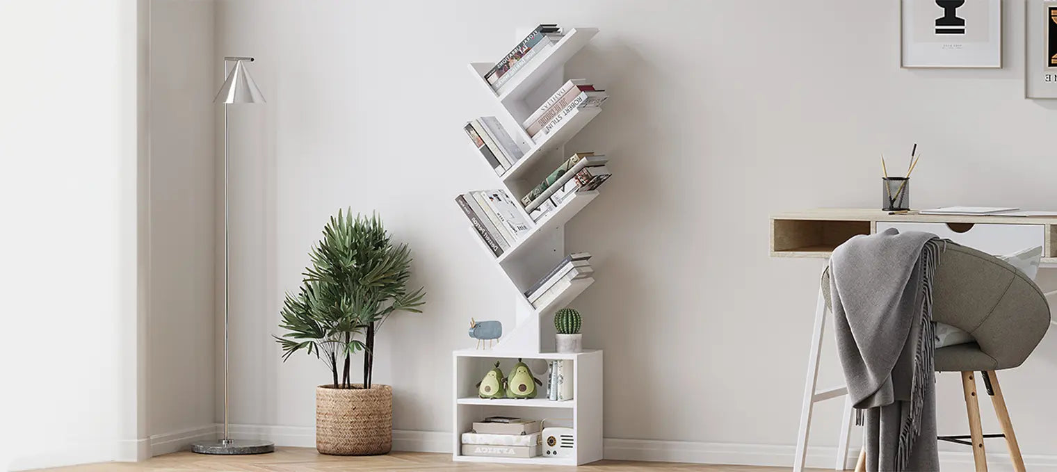 A compact wooden tree-design bookshelf by Sunmory, serving as a functional storage unit and decorative piece next to an office desk.
