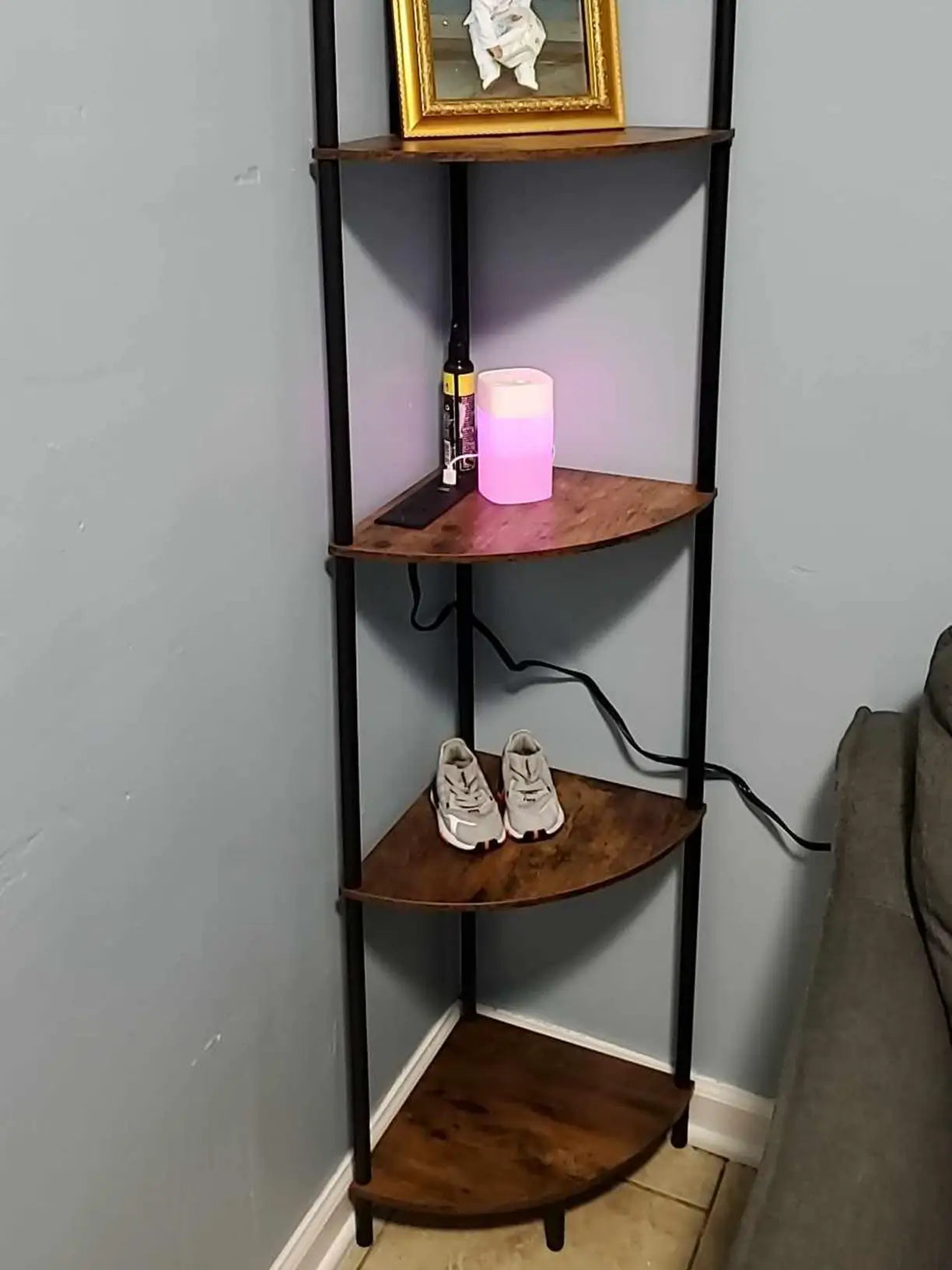An elegant corner shelf stand with smoothly curved tiers, providing a sophisticated display solution for collectibles or decor, enhancing the aesthetic of any room.