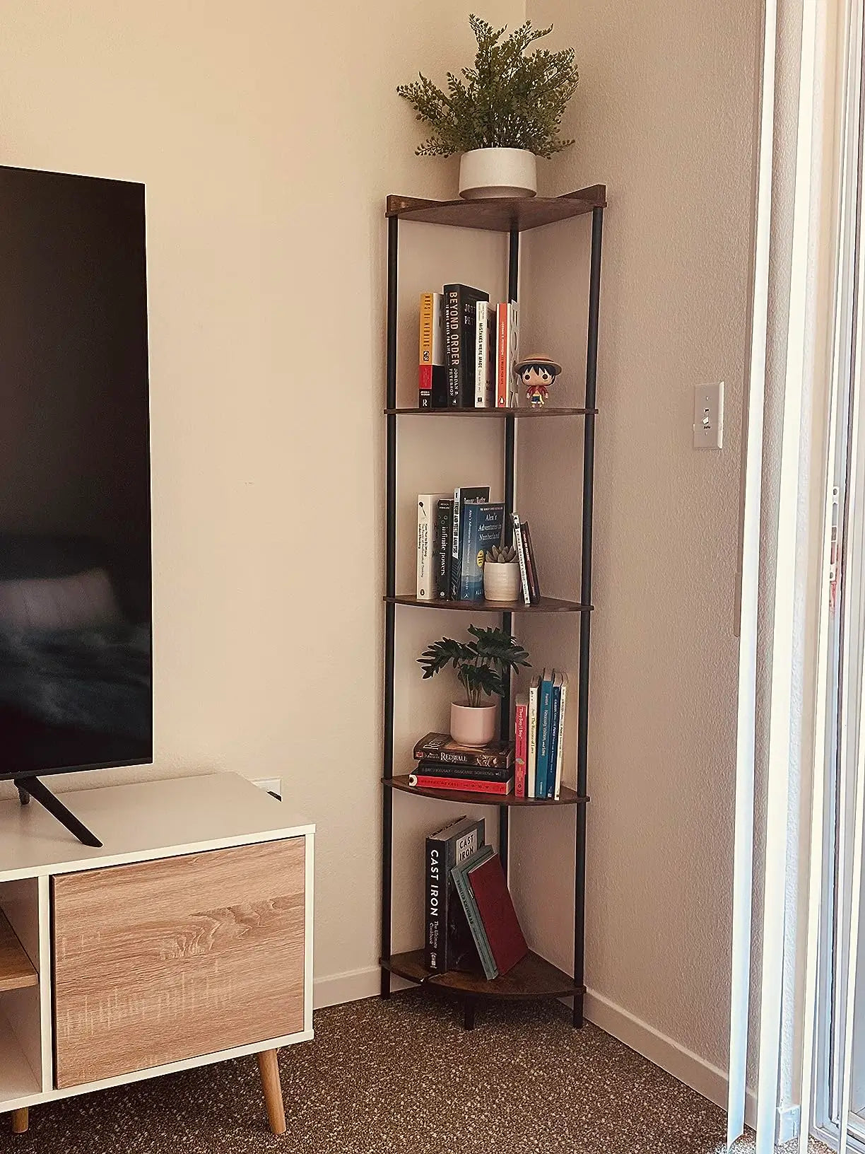 A minimalist corner shelf stand with a clean, understated design, offering practical shelving for books, small plants, or decorative pieces without cluttering the space.