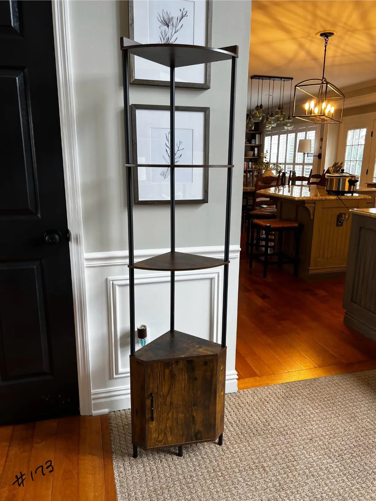 A tall corner cabinet shelf designed to maximize vertical storage, featuring several open compartments suitable for books, plants, or decorative items in any room.