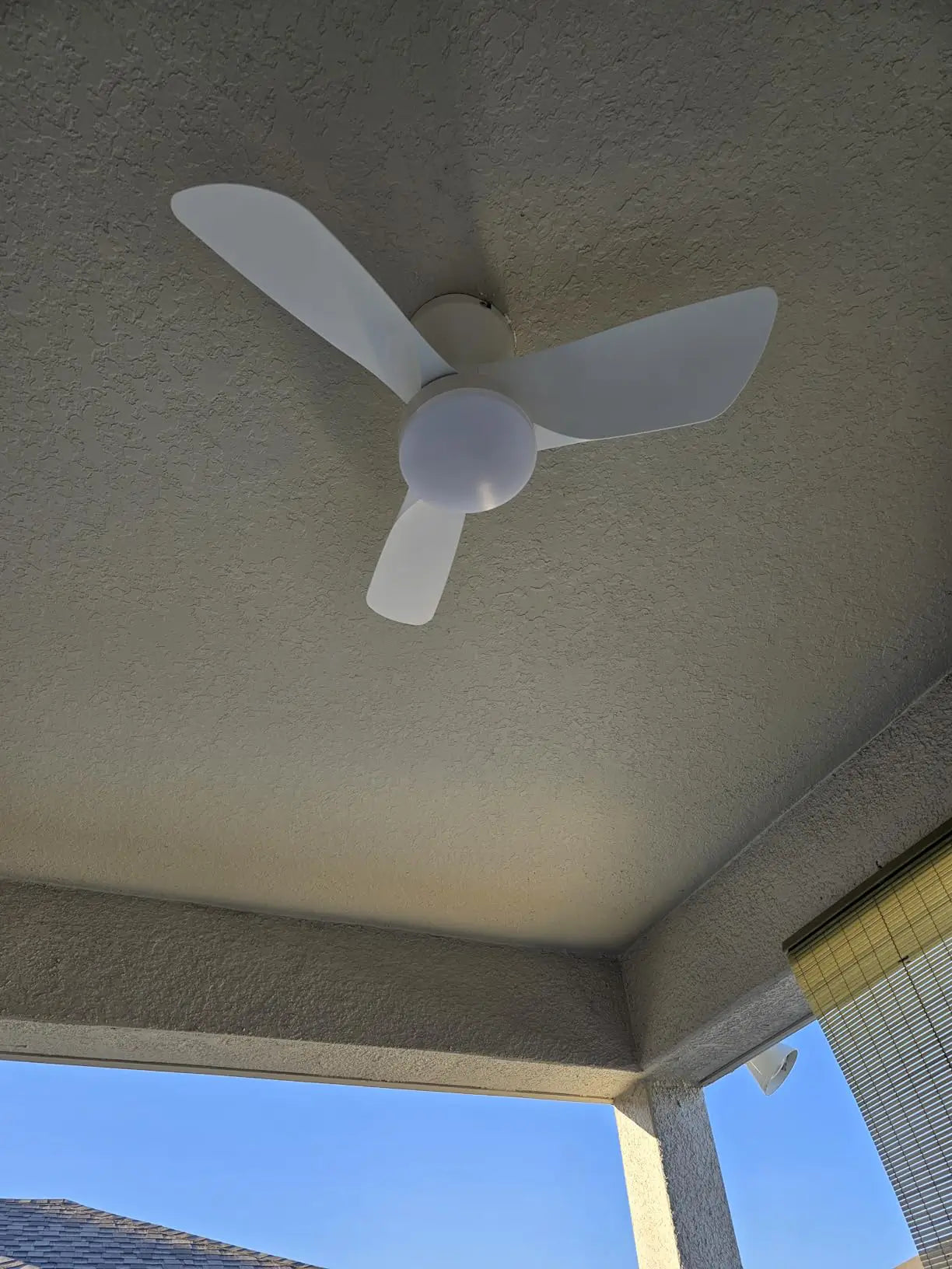 A contemporary ceiling fan featuring light-colored wooden blades and a central integrated light, offering a natural and stylish addition to a living space.
