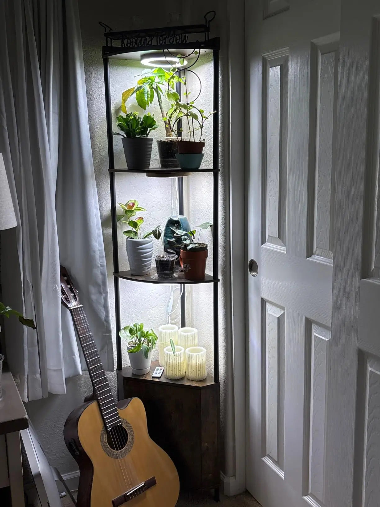 A modern white corner cabinet shelf with open shelving, offering a minimalist storage solution perfect for displaying decor in a contemporary living space.